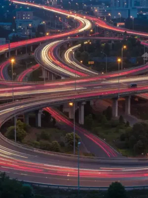 Modern highway interchange with flowing traffic at dusk, symbolizing advanced infrastructure and efficient national commutes.