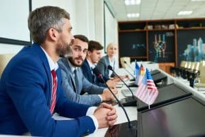 AI deepfake legislation: Mature Businessman in Political Press Conference